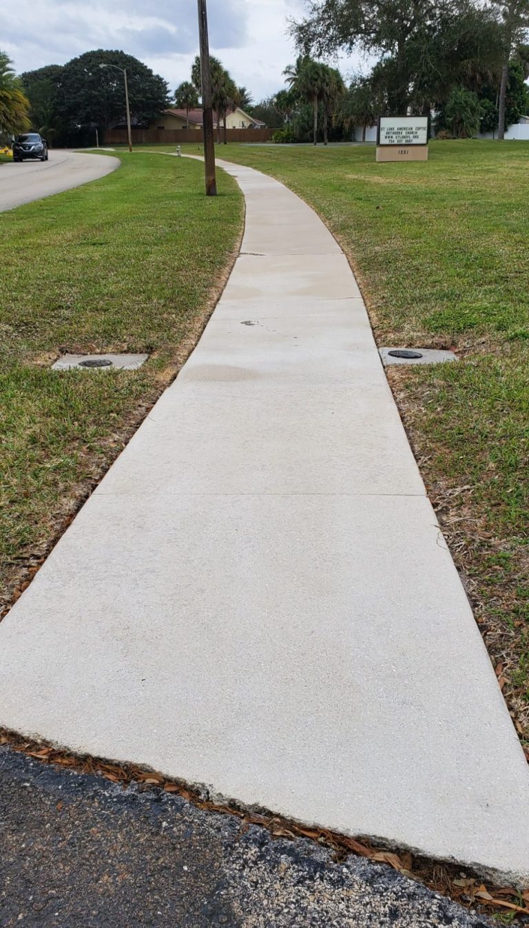 Sidewalk pressure washed and post treated